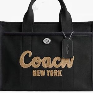 Used black Cargo Coach Tote, No Cross Body Strap.